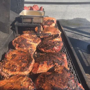 meat being cooked on a grill