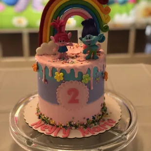 a cake with a rainbow on top