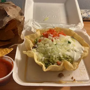 Taco Salad with Onions, Guacamole and Tomato     Salsa and Chips.