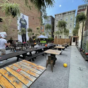 a row of picnic tables in an urban setting