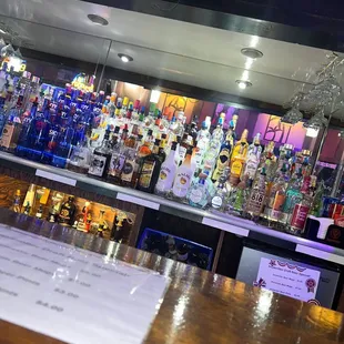 a bar with a lot of liquor bottles