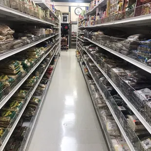 a wide aisle of food in a grocery store