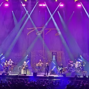 the band performing on stage