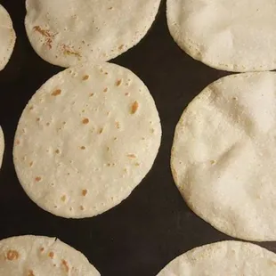 a close up of a pan of tortillas