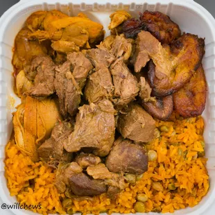 Bandera Platter with pollo guisado and masita de cerdo guisada over moro de gandules and maduros