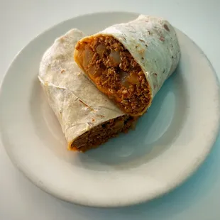 Breakfast Burros! Eggs and potatoes plus your choice of homemade Chorizo, Sausage, Ham or Bacon.