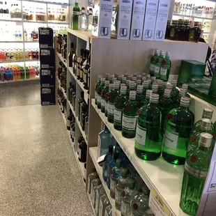 a liquor store with shelves filled with bottles of alcohol