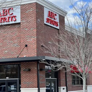 a brick building with a red awning