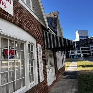 a storefront with a for sale sign in the window