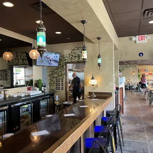 a man standing at the bar