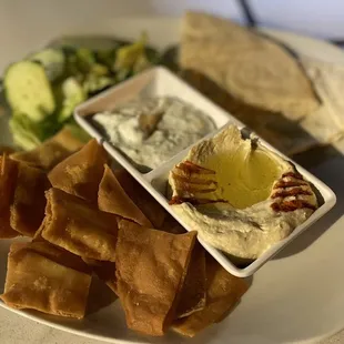 a plate of pita chips and dip