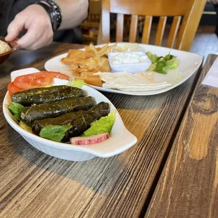 a plate of food on a wooden table