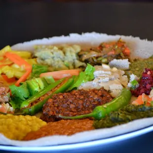 Yetsom Beyaynetu is an Ethiopian combination platter composed of a vegan  assortment of non-fasting foods  and veggies.