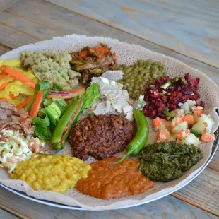 Yetsom Beyaynetu is an Ethiopian combination platter composed of a vegan  assortment of non-fasting foods  and veggies.