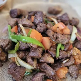 a pile of beef and vegetables