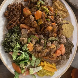 Beef tibs, lamb tibs, vegetable combo platter.