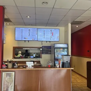 a restaurant counter with menus