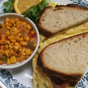 Build Your Egg Sandwich - egg, pork roll, cheese, on a toasted sour dough bread with some corn salsa for good measure!