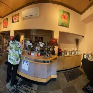 a man and a woman standing in front of a counter