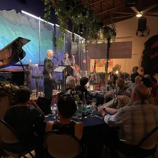 a group of people sitting around a table
