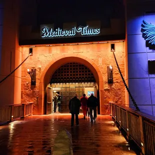 people walking through the entrance