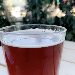 a glass of beer on a table