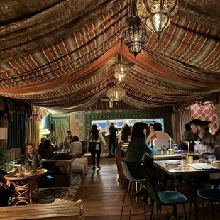 Lounge in the left. Tables and bar on the right when you walk in