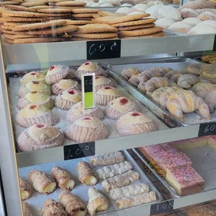 a variety of pastries in a display case