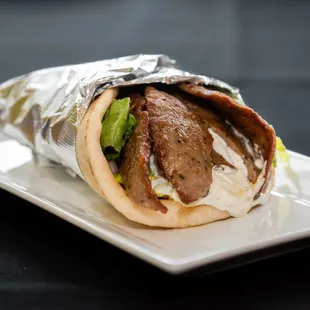 a beef wrap on a plate