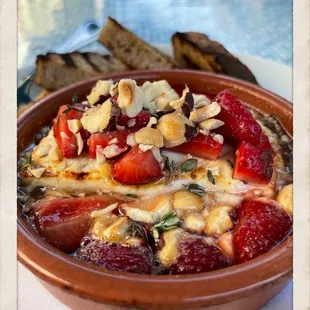 heated feta with hot strawberries and nuts