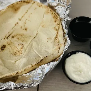 1 huge pita, top: olive oil and balsamic vinegar, middle: tzatziki sauce and bottom: Lebanese whipped garlic sauce