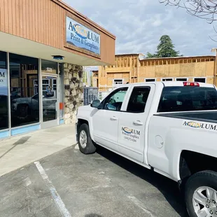 a truck parked in front of a restaurant