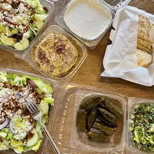 Greek salad, hummus, tzatziki, Tabouli, pita bread