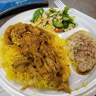 Curry chicken platter with sides of orzo salad and babba ghannoush