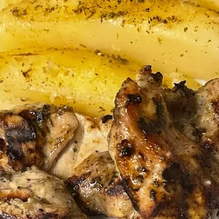 grilled chicken and potatoes on a plate