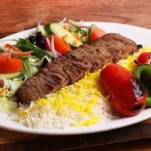 a plate of food on a wooden table