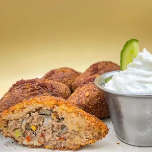 Kibbeh, a crushed wheat football filled &amp; fried with a slightly spicy ground beef &amp; vegetables mix made in house