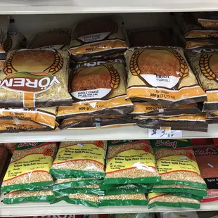 bread, rice, and bread rolls on display