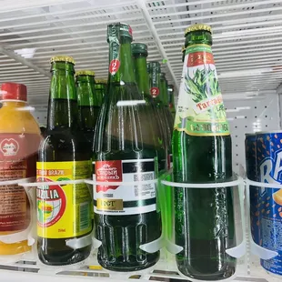 a fridge full of sodas and soft drinks