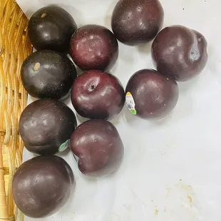 plums in a wicker basket