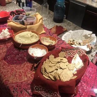My party spread. Spinach pies from the freezer section, Hummus, baba ganoush, pita bread, 3 different types of olives, feta cheese