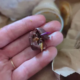 Olive with a seed, in the middle of a freaking sandwich. Not happy.