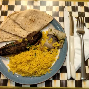 a plate of food on a checkered place mat