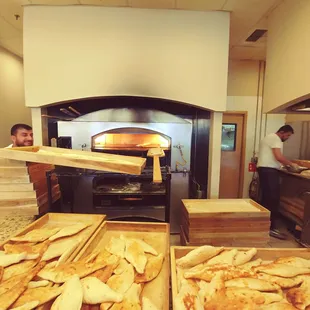 A peek at the bread oven and the shy but hard-working Baker