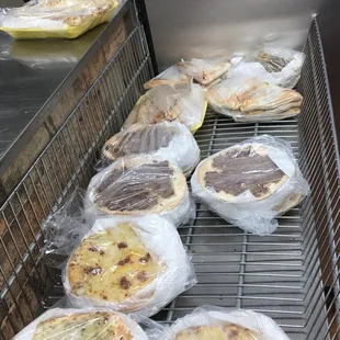 a line of flatbreads on a grill