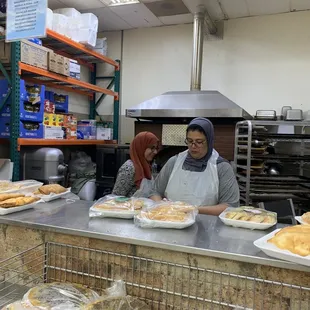The kindest ladies making fresh baked goods.