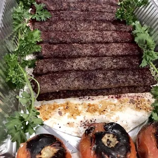 Traditional Kabob w/ tomatoes and pita bread.