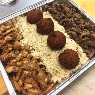a tray of meat, rice, and meatballs