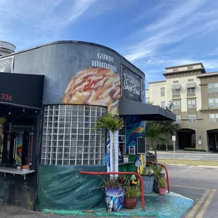 The restaurant is a to-go place, probably once an old fotomat.