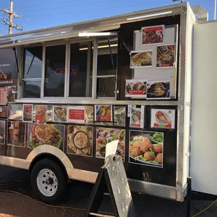 a man ordering food from a food truck